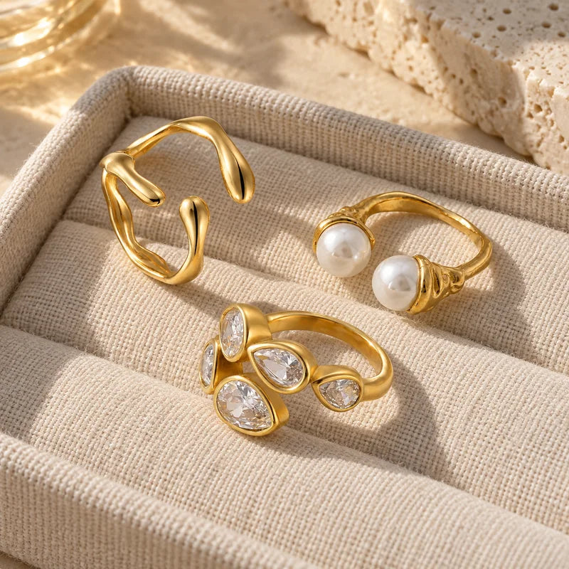Drift, Pearla and Lustre rings on a jewellery tray
